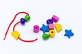 Colorful Rainbow Plastic Beads on White Background. Kid& x27;s DIY Craft. Children& x27;s Necklace Beads Royalty Free Stock Photo