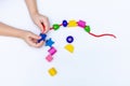 Colorful Rainbow Plastic Beads on White Background. Kid& x27;s DIY Craft. Children& x27;s Necklace Beads Royalty Free Stock Photo