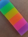 A colorful rainbow rubber with brown background