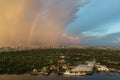 A colorful rainbow in the sky above skyscraper at bangkok