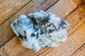 Colorful rainbow stone on rustic wood background