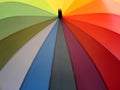 Colorful rainbow umbrella, multicolored background. Royalty Free Stock Photo
