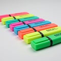 Colorful, rectangular highlighters are arranged diagonally on a white surface. Each Royalty Free Stock Photo