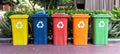 Colorful recycling bins for sorting different types of waste at collection point Royalty Free Stock Photo