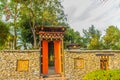 Colorful red Bhutan temple entrance gate decoration at the public park, Royal Flora Rajapruek, Chiang Mai, Thailand. Royalty Free Stock Photo