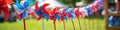 Colorful red and blue pinwheels on a sunny summer day Royalty Free Stock Photo