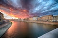 Scenic sunset on river in Pisa