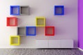 Colorful red, blue, yellow and grey empty square shelves on white wall in room with wooden floor and pink wall - object exhibit or Royalty Free Stock Photo