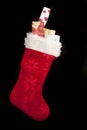 Colorful red Christmas stocking with gifts Royalty Free Stock Photo