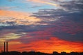 Colorful red orange dark dramatic evening sky over industrial la Royalty Free Stock Photo