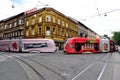 Colorful red and pink trams in side view. main street in downtown area in Zagreb