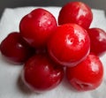 Colorful Red plums kept in white background and reduce the risk of cancer heart disease and diabetes