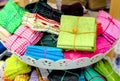 colorful red, purple, pink, yellow, blue, green and orange textile fabrics for sale in a shop Royalty Free Stock Photo