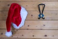 Colorful red Santa Hat hanging on a wall Royalty Free Stock Photo