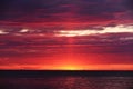 Colorful red sunset sunrise at sea. Water and sky. Minimalism in nature.