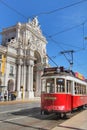 Colorful red tram at the Commerce Square of Lisbon in Spring Royalty Free Stock Photo