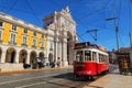 Colorful red tram at the Commerce Square of Lisbon in Spring Royalty Free Stock Photo