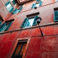 A colorful red wall of an old building in Rome Royalty Free Stock Photo