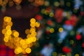 Colorful Red, Yellow and Green Christmas Tree Bokeh background of de focused glittering lights, Christmas background pattern Royalty Free Stock Photo