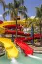 Colorful red and yellow water slide in aqua park. Royalty Free Stock Photo