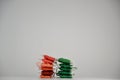 Colorful reddish and green tones thread spools isolated on a white background