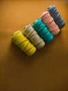 Colorful reels of macrame cord threads or wool shot as copy space background or text background