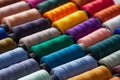 Colorful reels of threads background. Textile factory