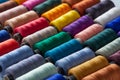 Colorful reels of threads background. Textile factory