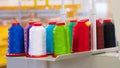 Colorful reels of threads industry background, Spools of colored cotton thread, ordered composition