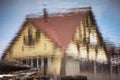 Colorful reflection of an architectural building in water with ripples. Royalty Free Stock Photo