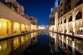 Colorful reflection of souk building in Downtown area during calm night. Dubai, United Arab Emirates. Royalty Free Stock Photo