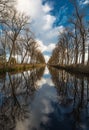 Colorful reflections at the canal near Bruges, portrait orientation, morning shot Royalty Free Stock Photo