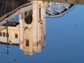 Architectural features of Burrard bridge Vancouver seen in reflection below Royalty Free Stock Photo