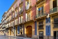 Colorful residential building facade on a side street in Ciutat Vella area of Valencia, Spain