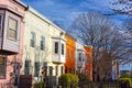 Colorful residential row houses under bright afternoon sun. Royalty Free Stock Photo
