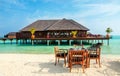 Colorful restaurant at the background of water bungalows in tropical Maldives island Royalty Free Stock Photo