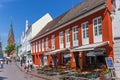 Colorful restaurant and church tower in Flensburg