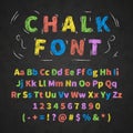 Colorful retro hand drawn alphabet letters drawing with chalk on black chalkboard