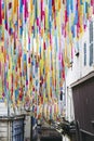 Colorful ribbons hanging as decor in a street