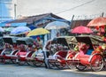 Colorful rickshaws waiting for passengers in Melaka, Malaysia