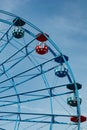 Colorful ride ferris wheel in motion in amusement park on sky background Royalty Free Stock Photo