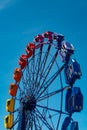 Colorful ride in motion in amusement park on sky background Royalty Free Stock Photo