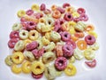 Colorful Ring-Shape Fruity Cereal with Milk in White Bowl