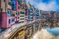 Colorful river-front houses of all shapes and sizes, painted in