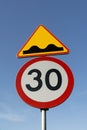 Colorful road signs against the blue sky