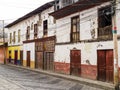 Colorful road with traditional houses in colonial style in Alausi, village famous for the devil`s nose train, Ecuador