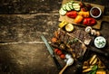 Colorful roast vegetables and grilled t-bone steak Royalty Free Stock Photo