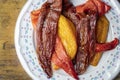 Colorful roasted in oven Poivron peppers on a cast iron grilling pan Royalty Free Stock Photo