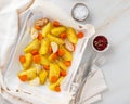 Colorful roasted vegetables on tray with parchment. Potatoes, ca