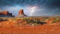 Colorful rock formations with a dusting of snow in the Navajo Nation Park Monument Valley during a lightening storm